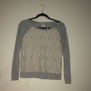 A dressy Sweater with design stitching.